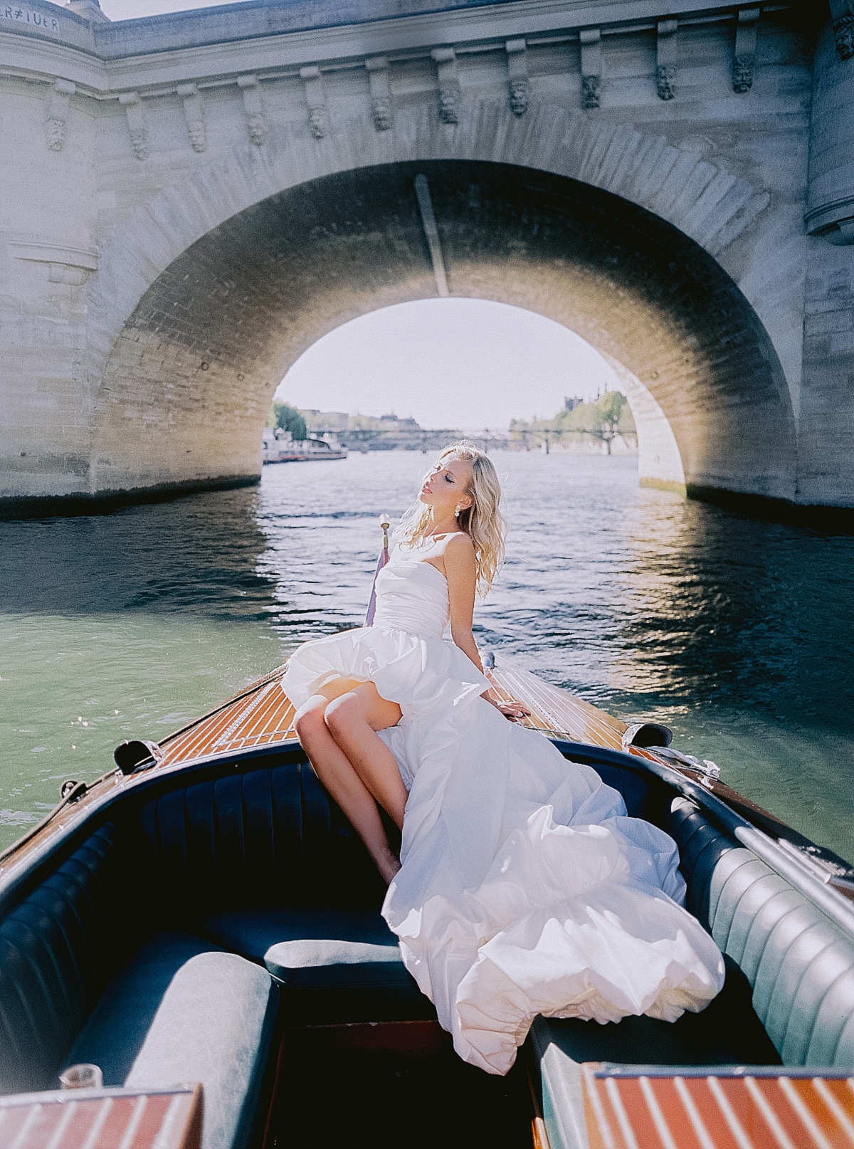 pre wedding photos for your engagement shoot in paris on a boat cruise on the Seine river by film photographer Audrey