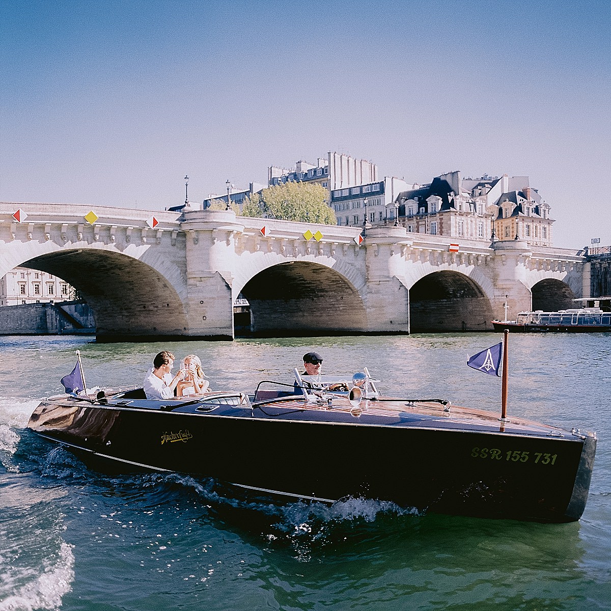 pre wedding photos for your engagement shoot in paris on a boat cruise on the Seine river by film photographer Audrey