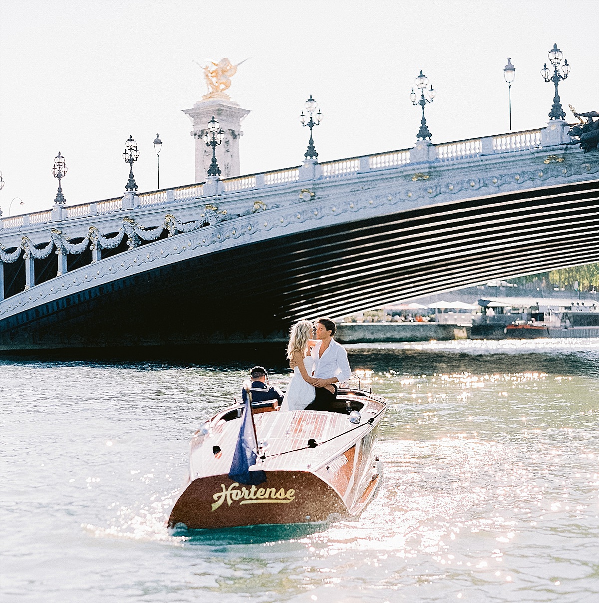 pre wedding photos for your engagement shoot in paris on a boat cruise on the Seine river by film photographer Audrey