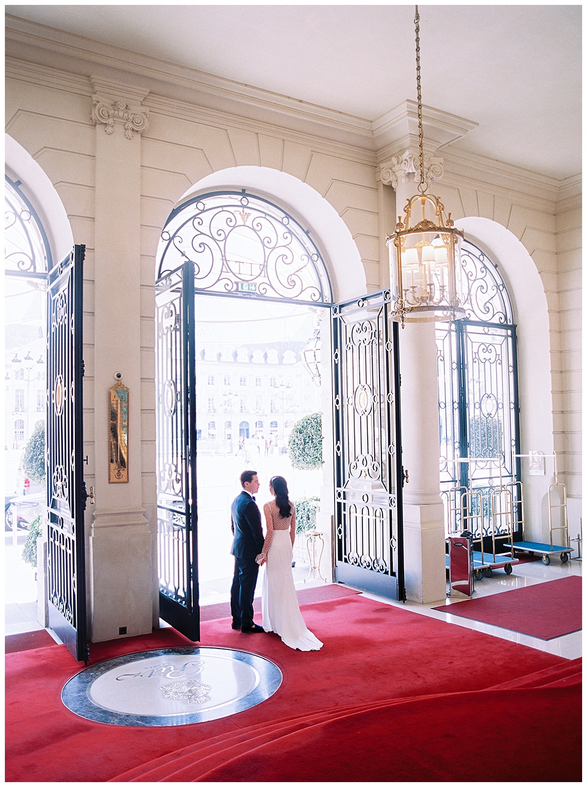 The bride and groom in the entrance of the ritz