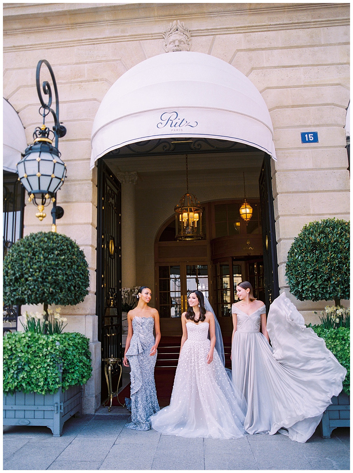 the bride and her bridesmaid walk out the Ritz 