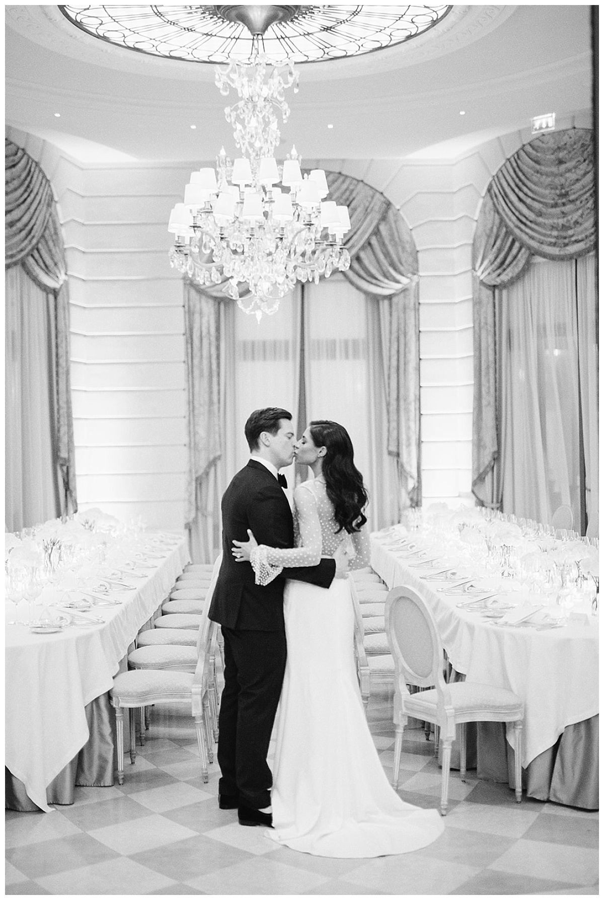 A wonderful couple kissing in an historic salon of the ritz for their wedding 