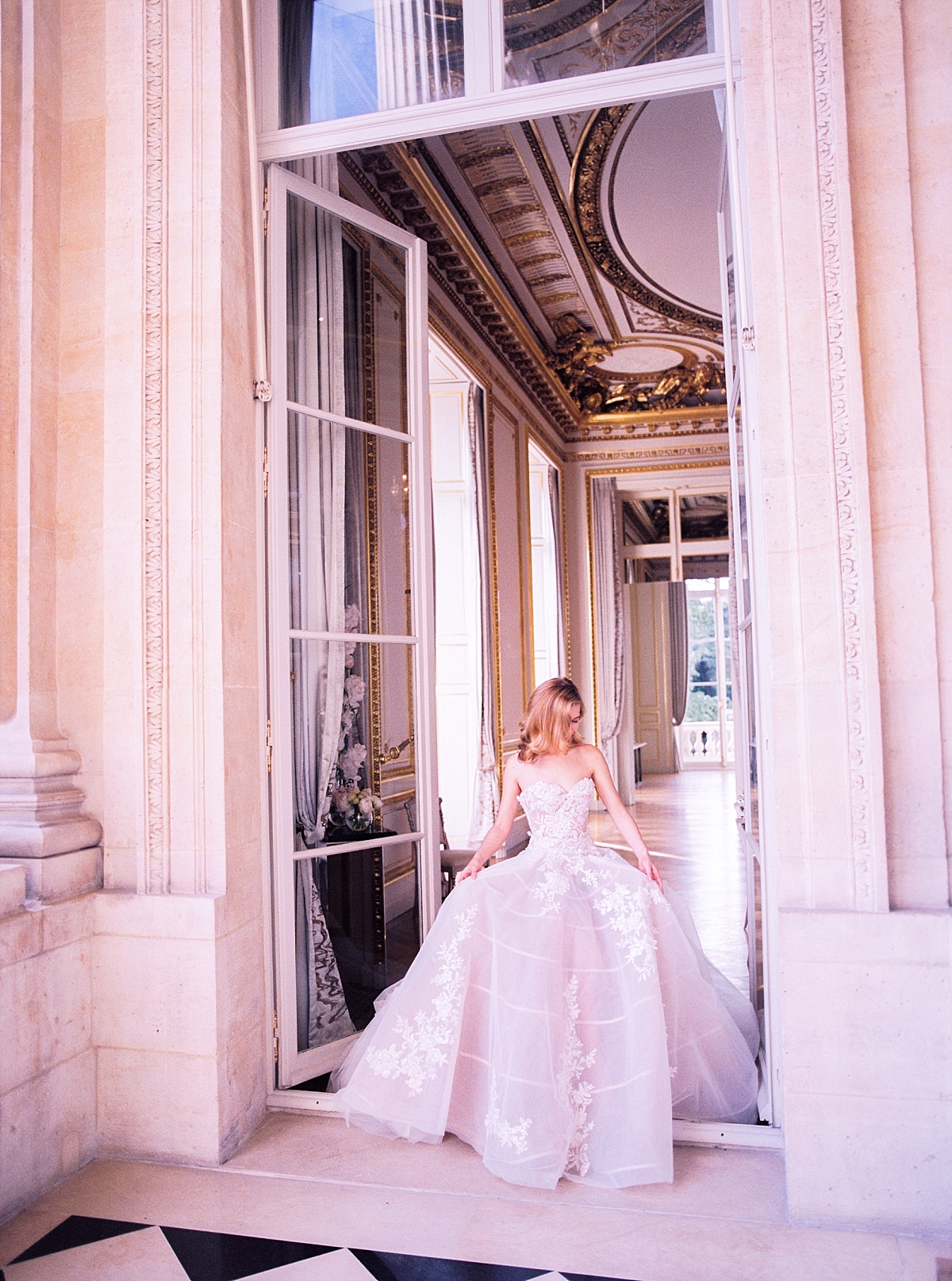 The bride walking out the historic salon of the hotel de Crillon Paris 