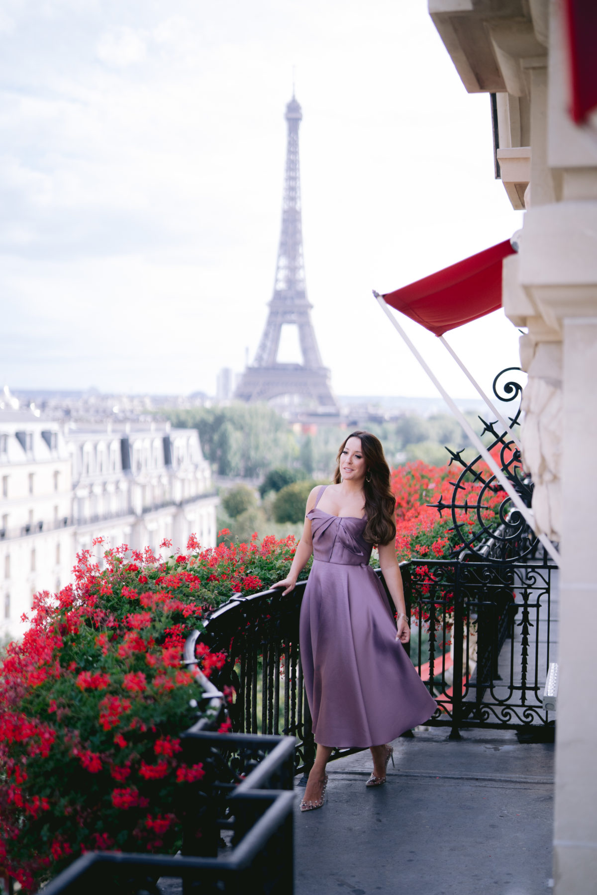 girl on the balcony of the suite of the plaza athénée 