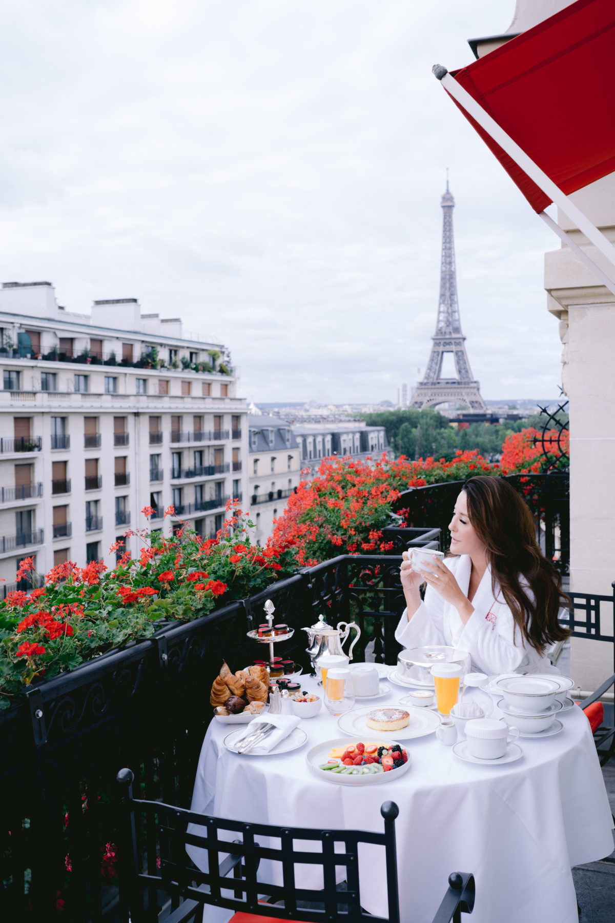 girl taking her breakfast on the balcony of the plaza athénée