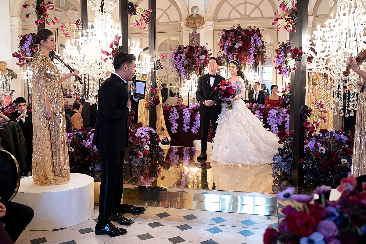 Valencia Tanoesoedibjo & Kevin Sanjaya listening to the speeches of their guests for their wedding at Chateau de Vaux le Vicomte 